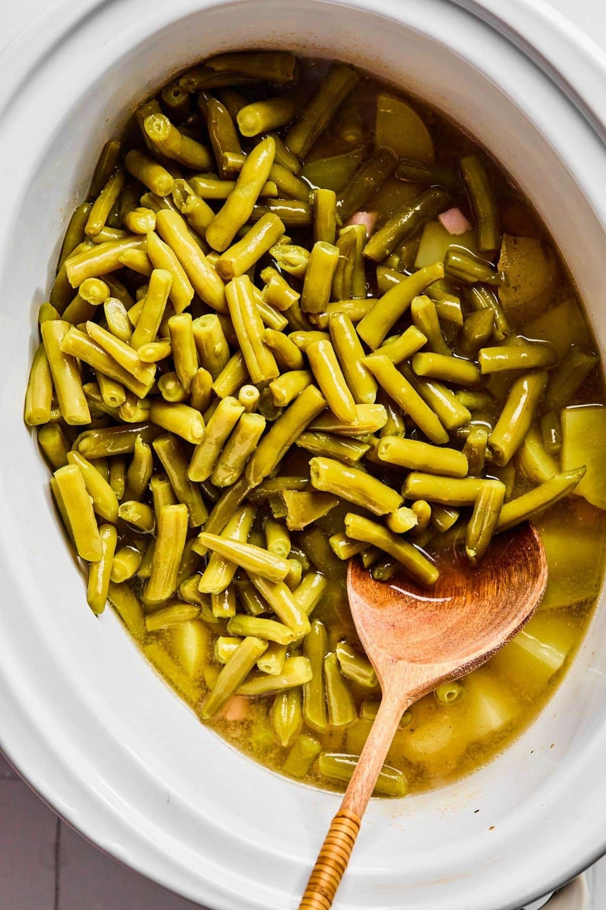 Green beans added to the crock pot.