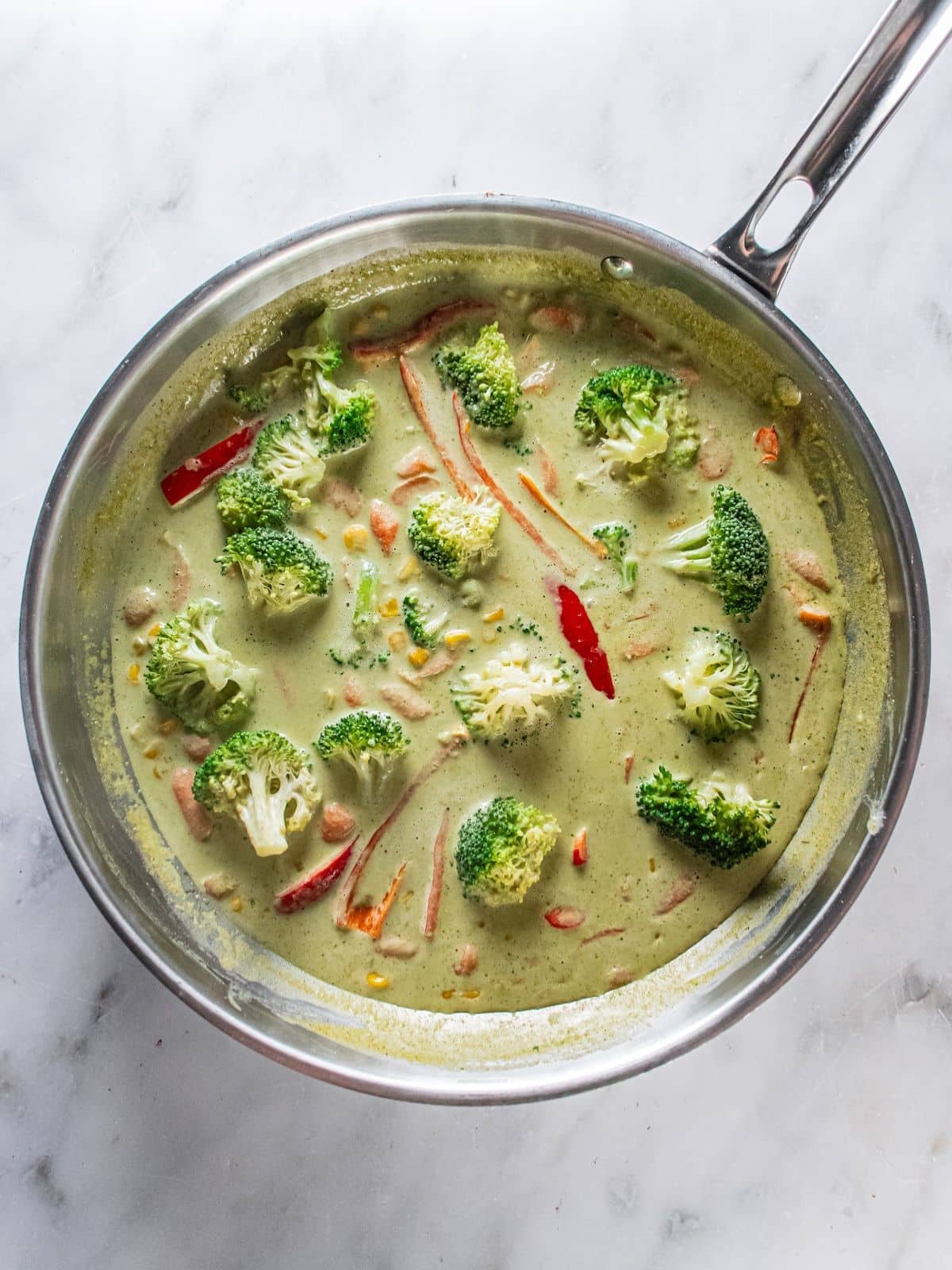 Broccoli added to the curry sauce.