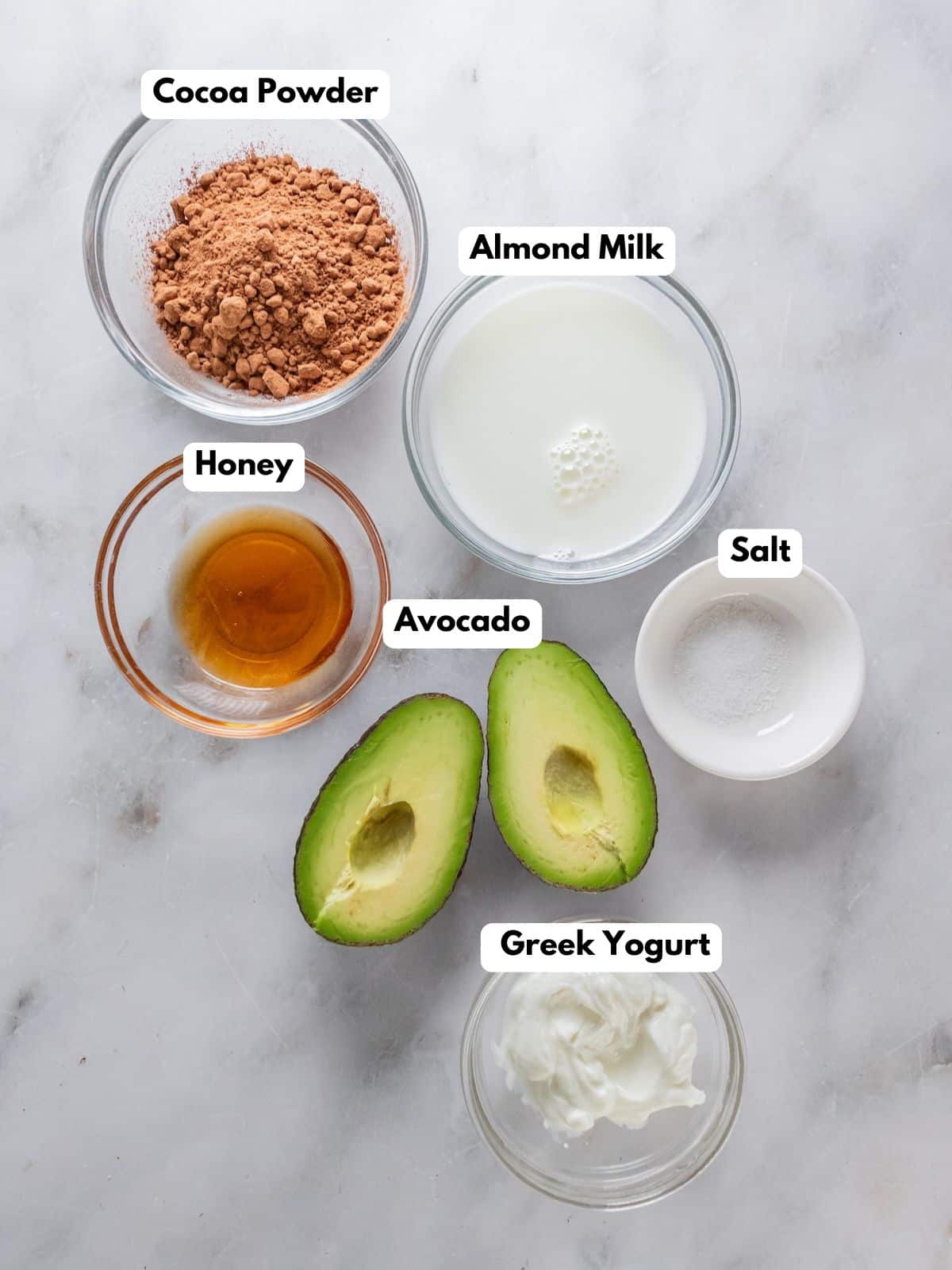 Ingredients to make this healthy chocolate mousse with avocado on a table.