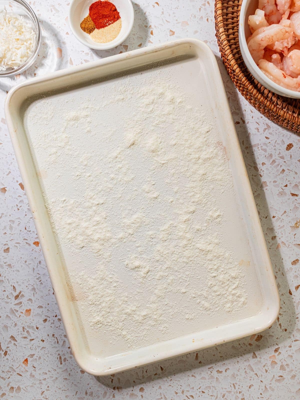 Flour on a sheet tray.
