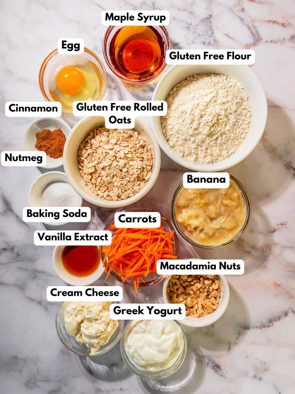 Ingredients to make this carrot banana bread in bowls on a table.