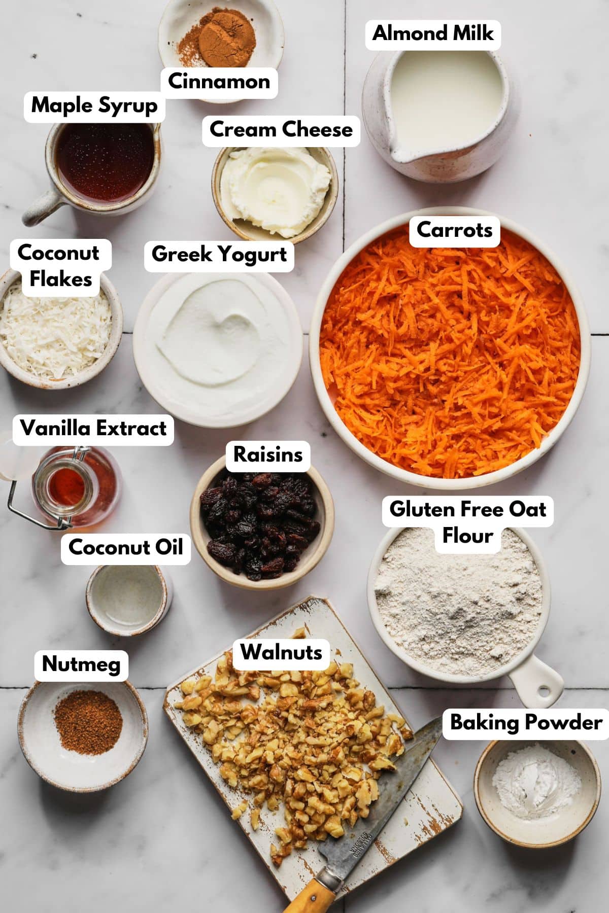 Ingredients to make these carrot pancakes in bowls on a table.
