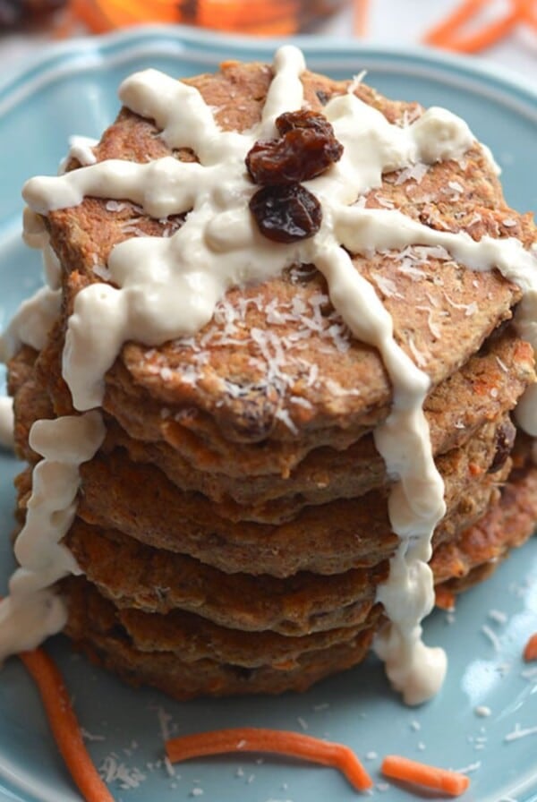 Carrot cake pancakes with icing drizzled down the sides.