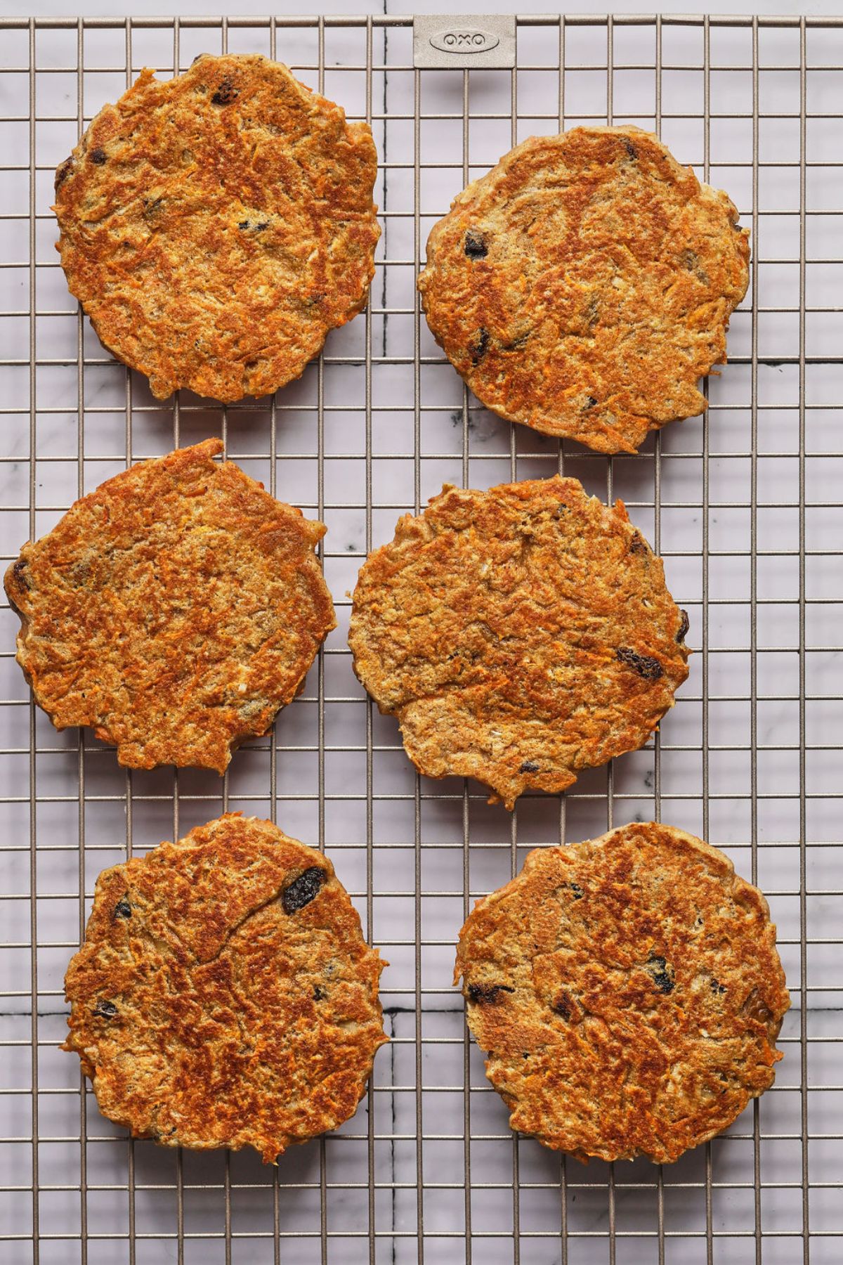 Carrot cake pancakes on a cooling wrack.