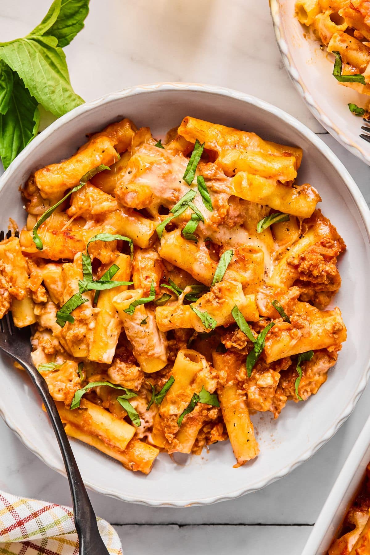 Cottage cheese baked ziti with basil for garnish on top.