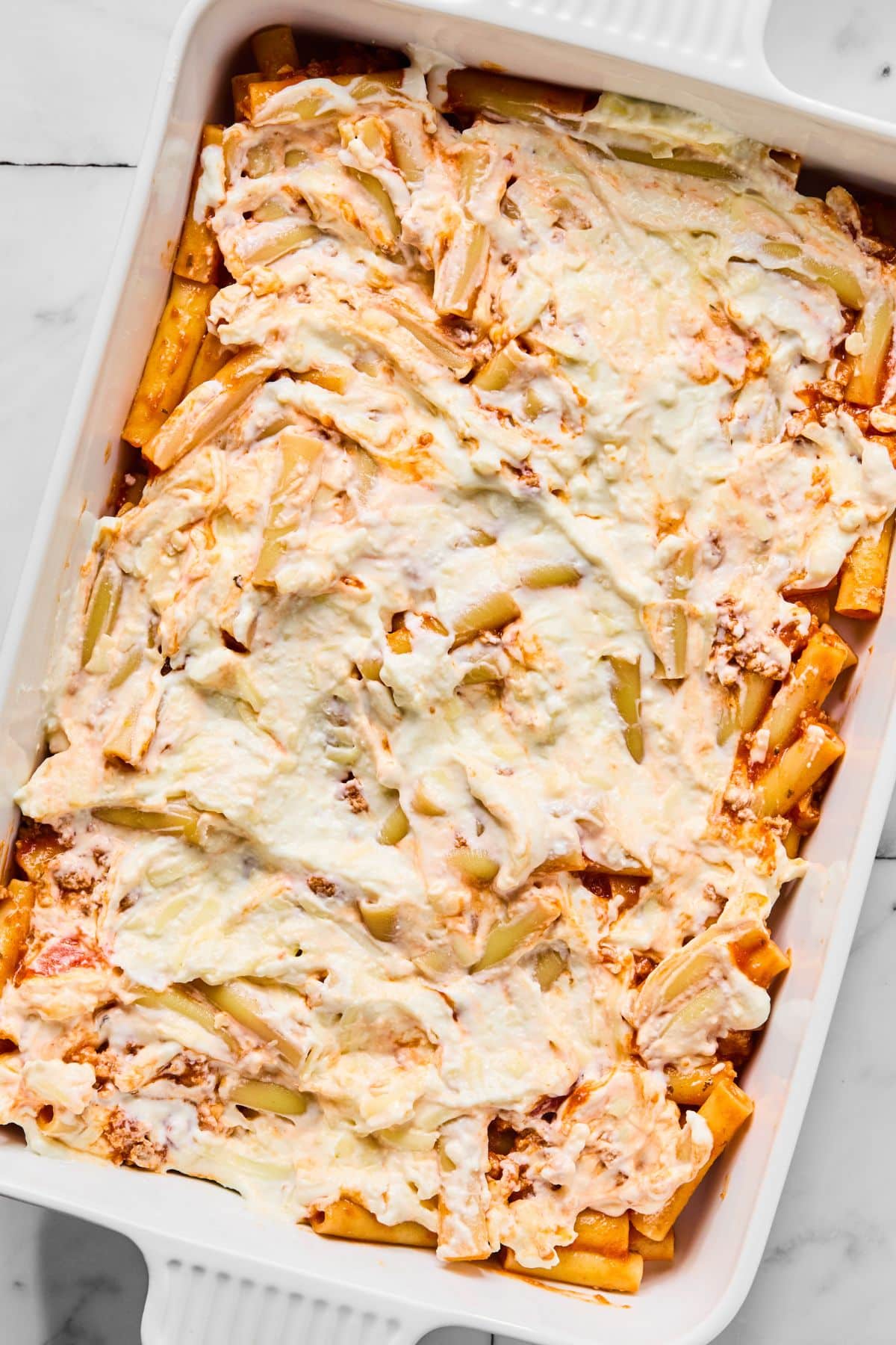 The cheese mixture spread on the pasta.