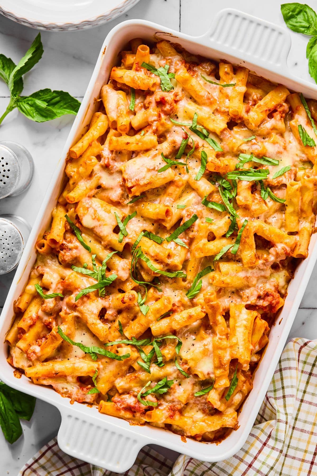 The cottage cheese baked ziti cooked and garnished with basil.