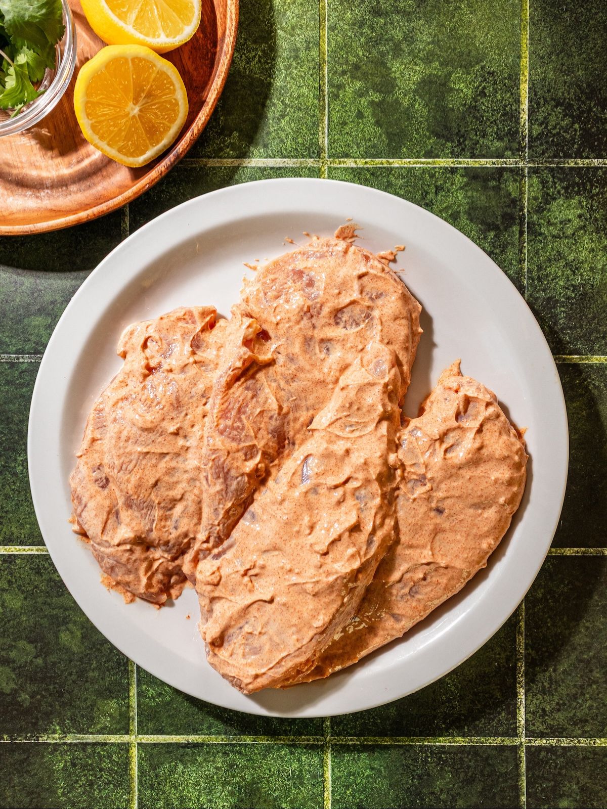 Yogurt covering the chicken.