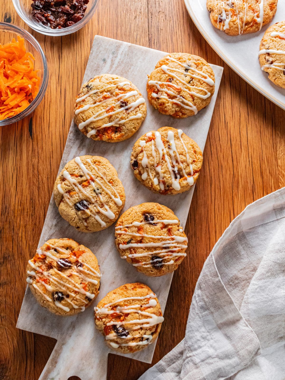 Healthy carrot cake cookies on a cutting board.