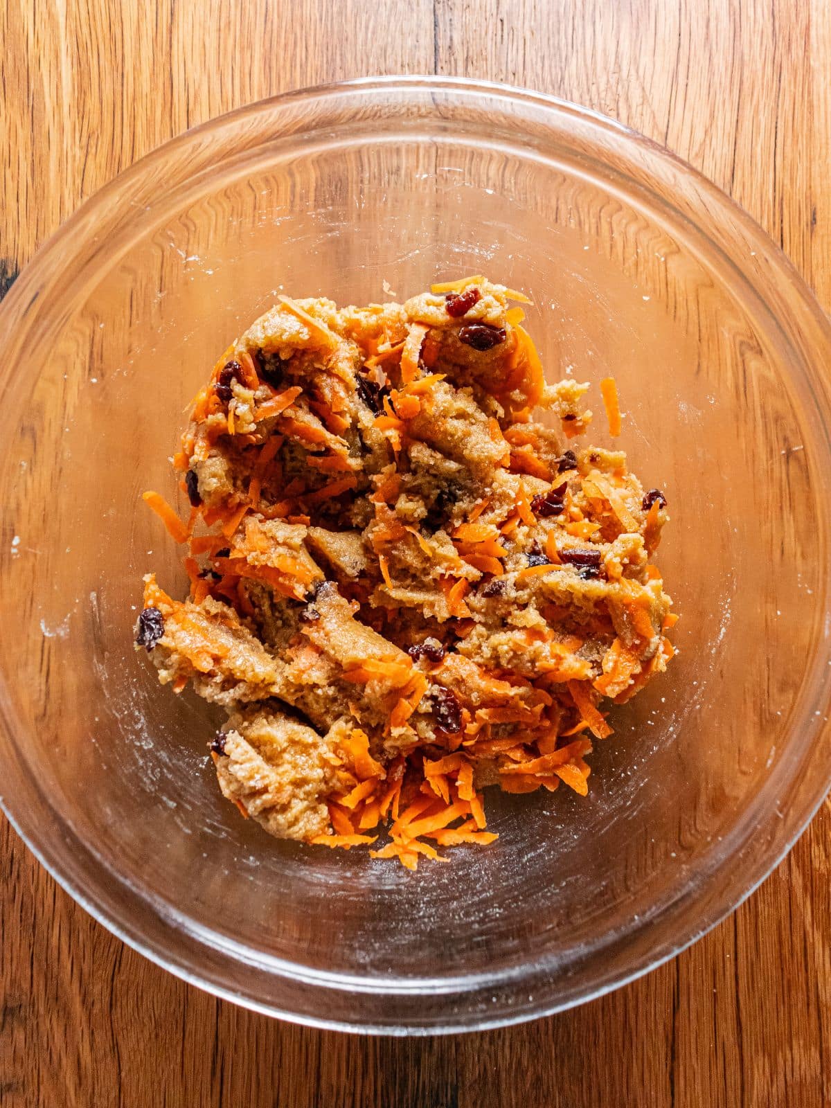 Carrots and raisins added to the bowl.