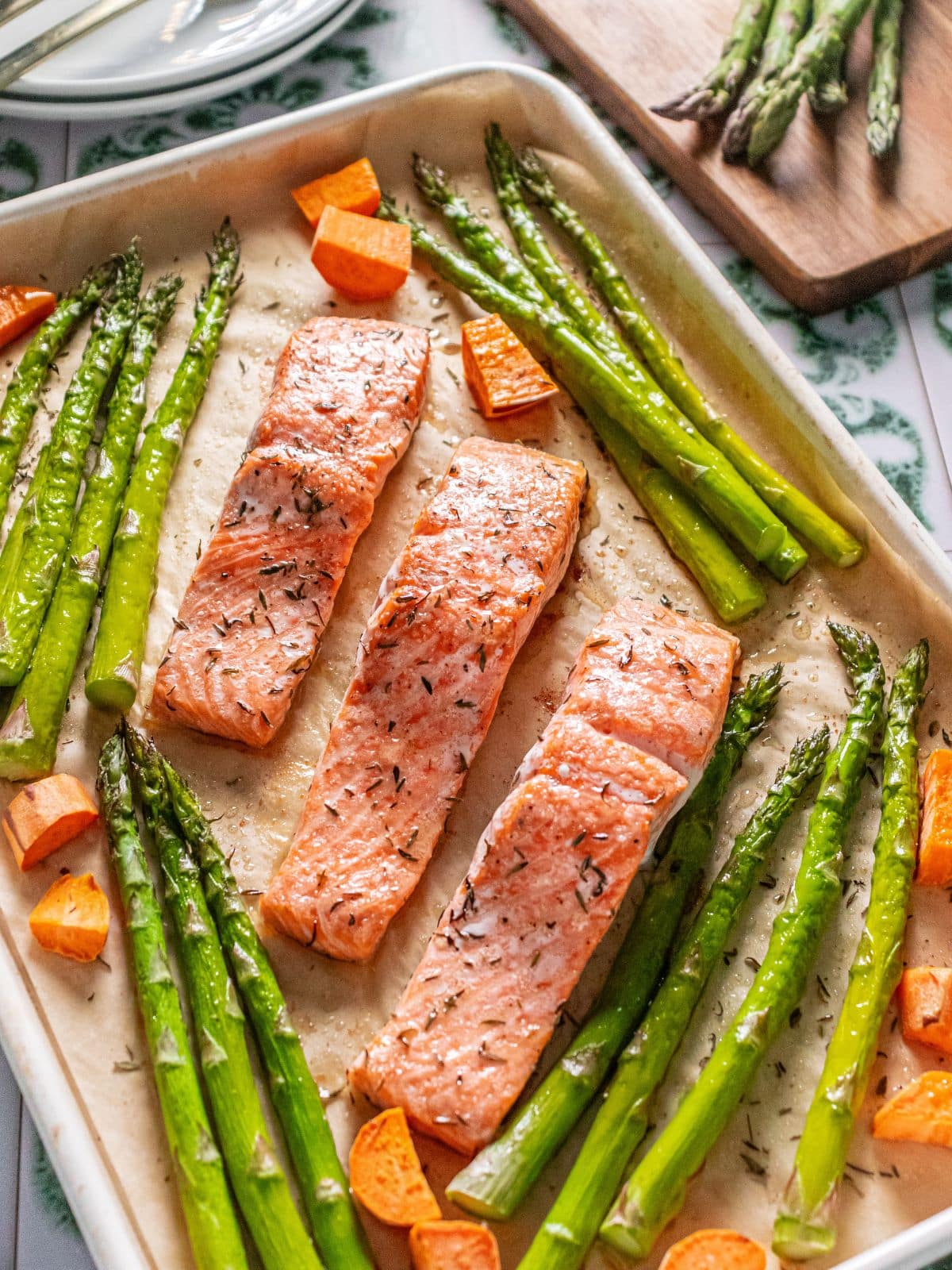 Sheet pan salmon with sweet potatoes and asparagus.
