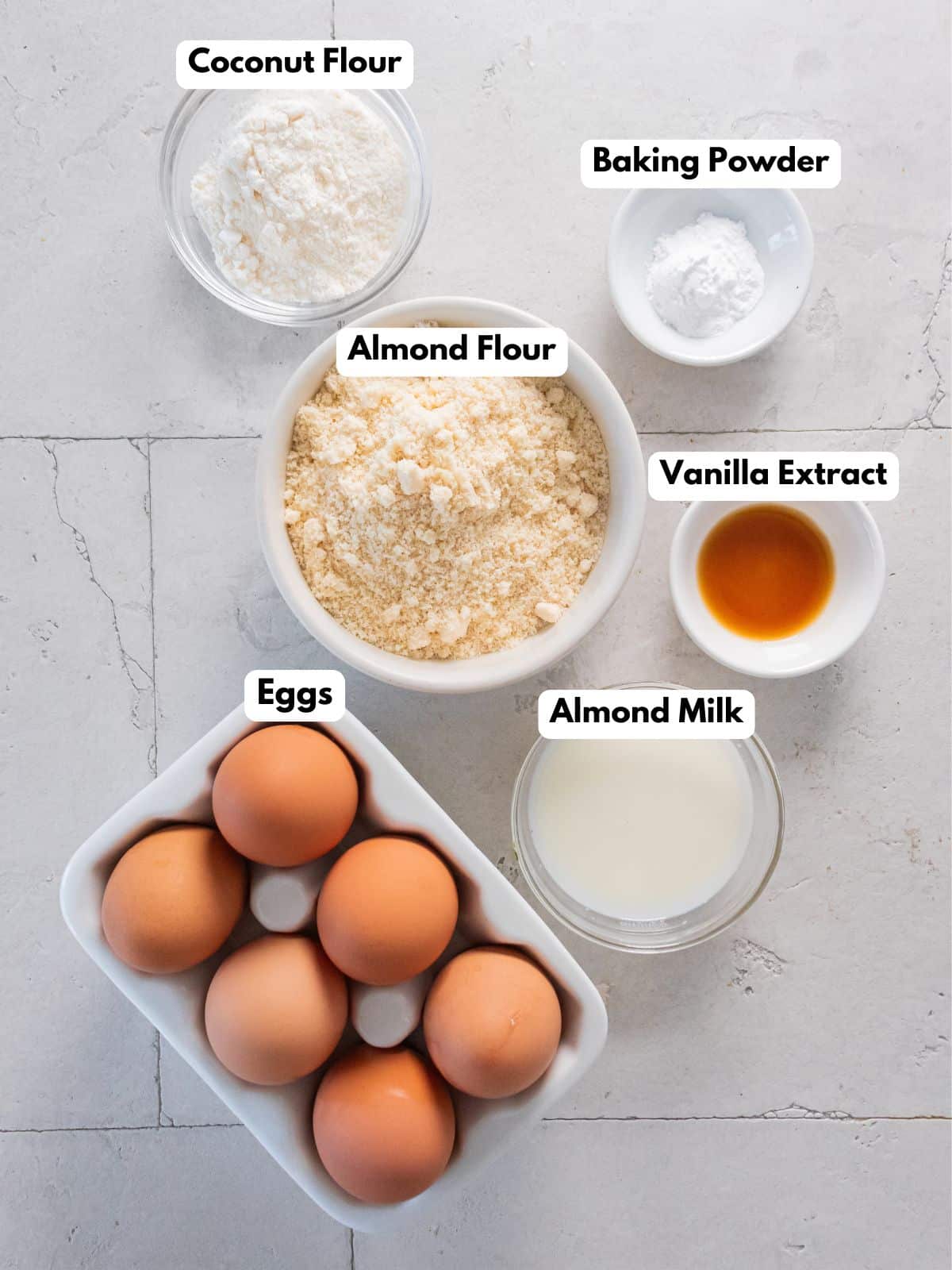 Ingredients to make these almond flour pancakes on a table.