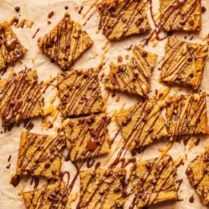 Chickpea blondies with chocolate and peanut butter drizzled on top.