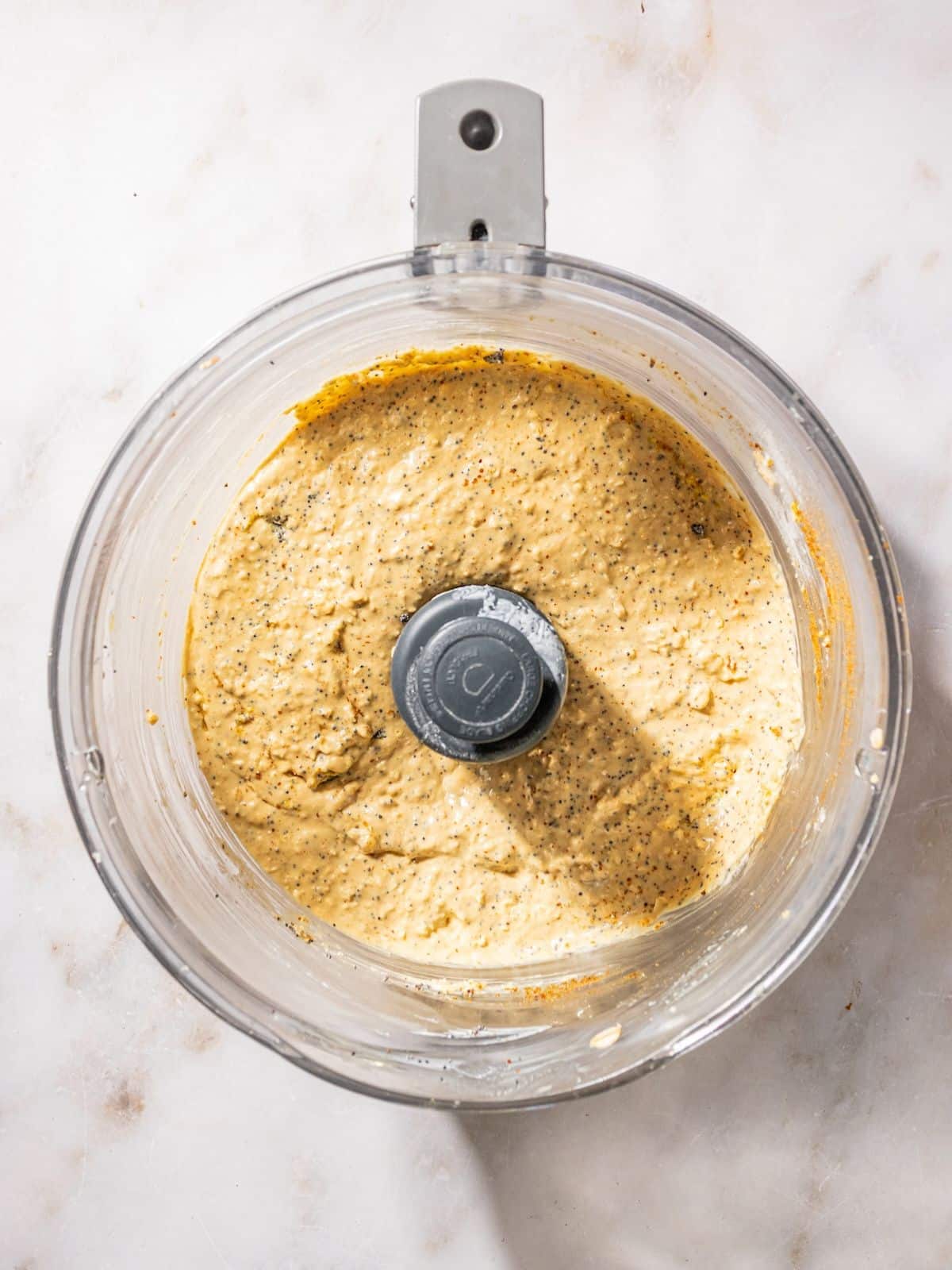 Coconut sugar, poppy seeds, lemon, olive oil, baking power, baking soda and salt added to the blender.