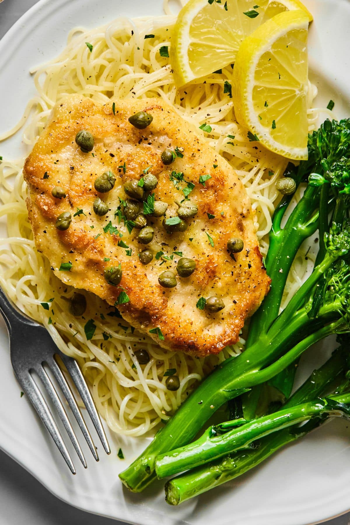 Healthy chicken piccata with capers on top.