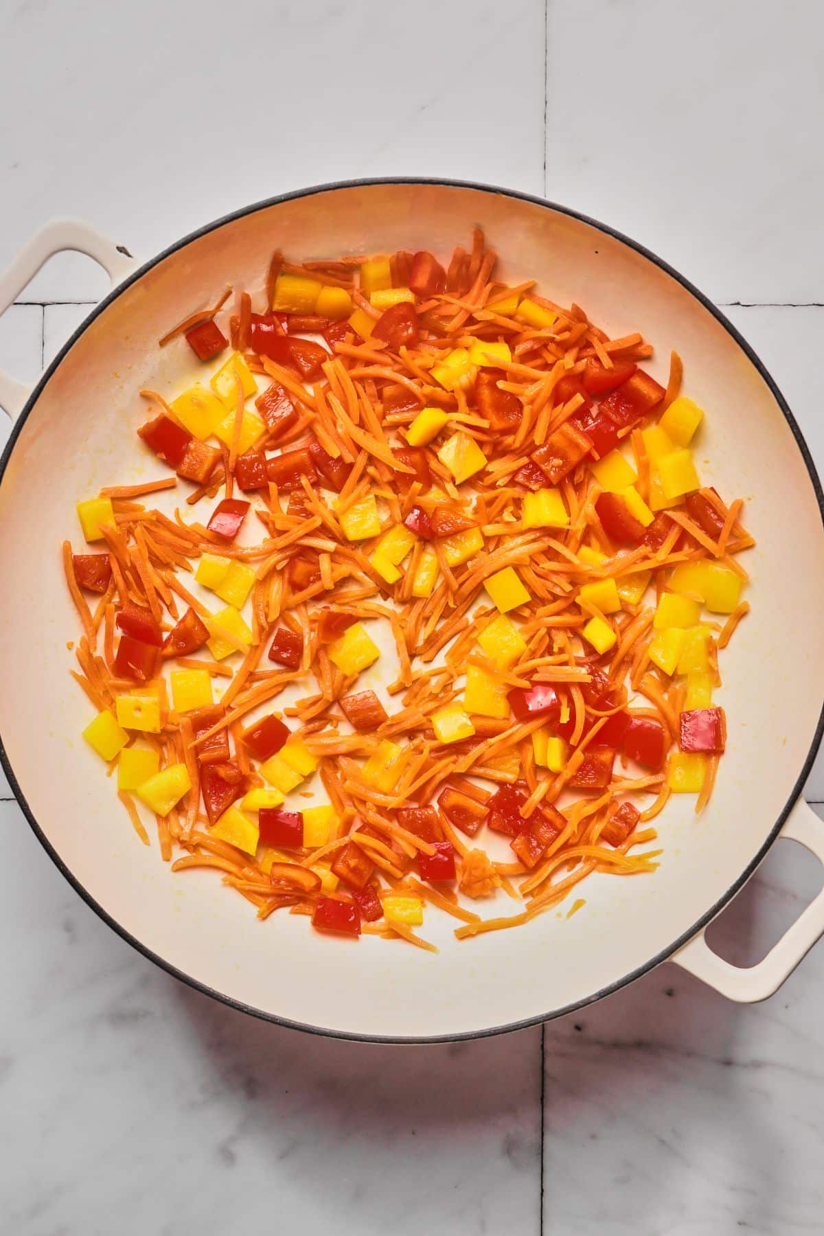 Peppers and carrots in a pan.