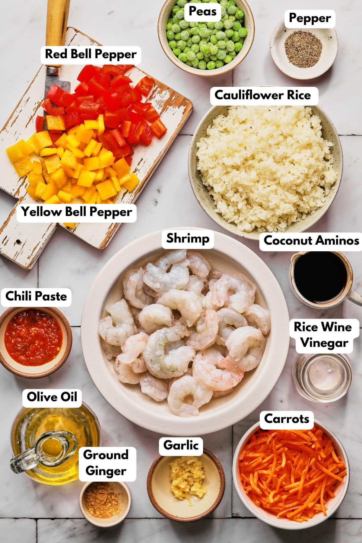 Ingredients to make this healthy shirmp fried rice on a table.