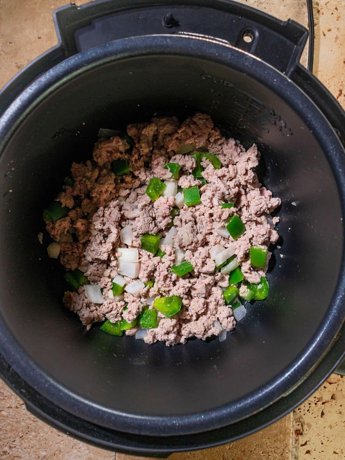 Ground turkey, onions and onions in a instant pot.
