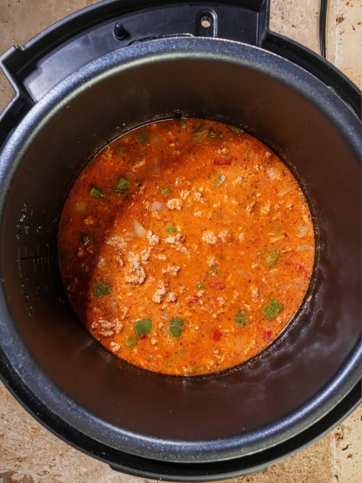 Salsa and broth added to instant pot.