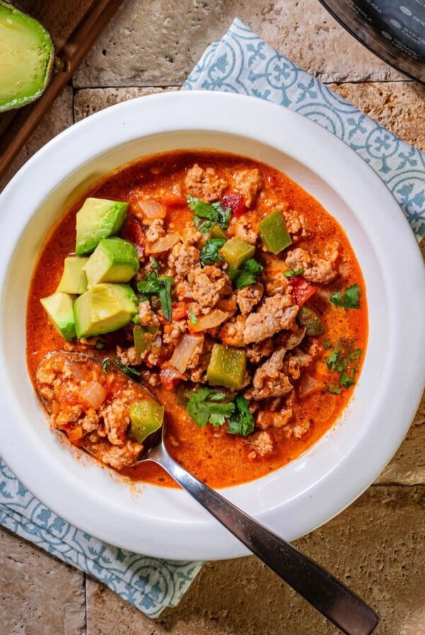 A spoon scooping out some Instant pot taco soup.