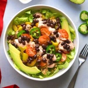Low calorie taco salad in a bowl with a fork on the side.