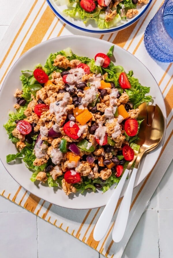 The salad assembled with the dressing on top.
