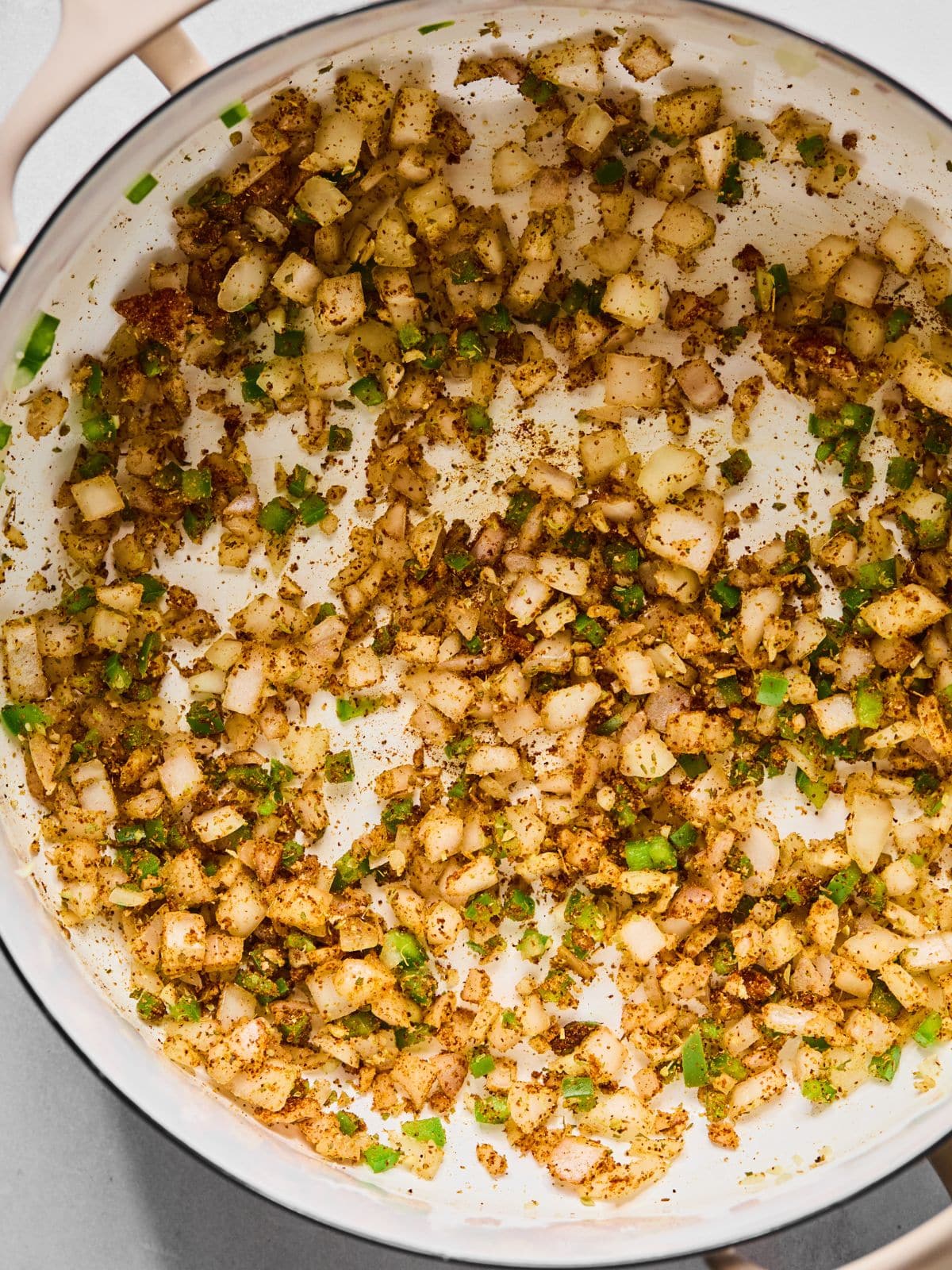Spices added to the pan.