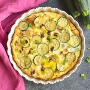 A sweet potato egg bake with zucchini on top.