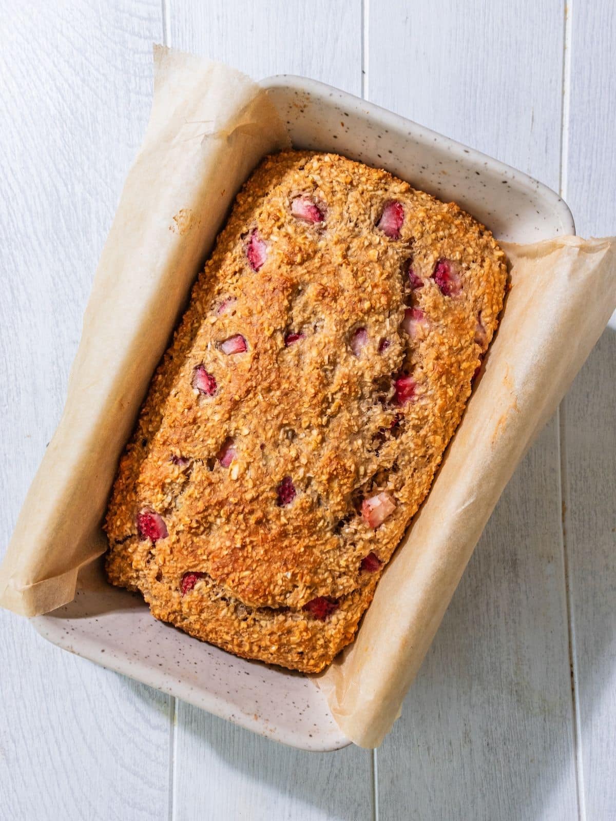 The bread cooked and cooling in the pan.