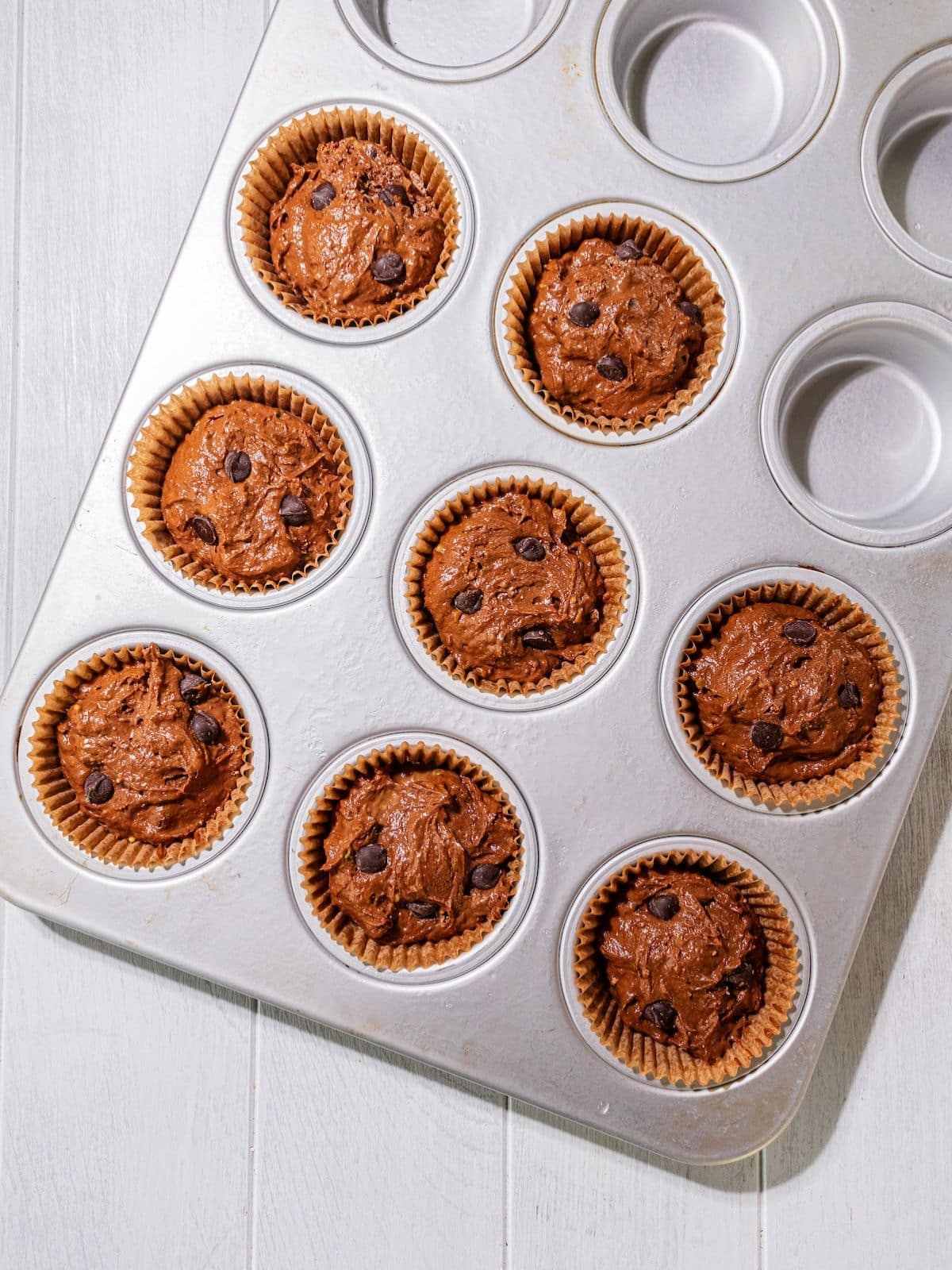 Muffin batter put into a cupcake tray.