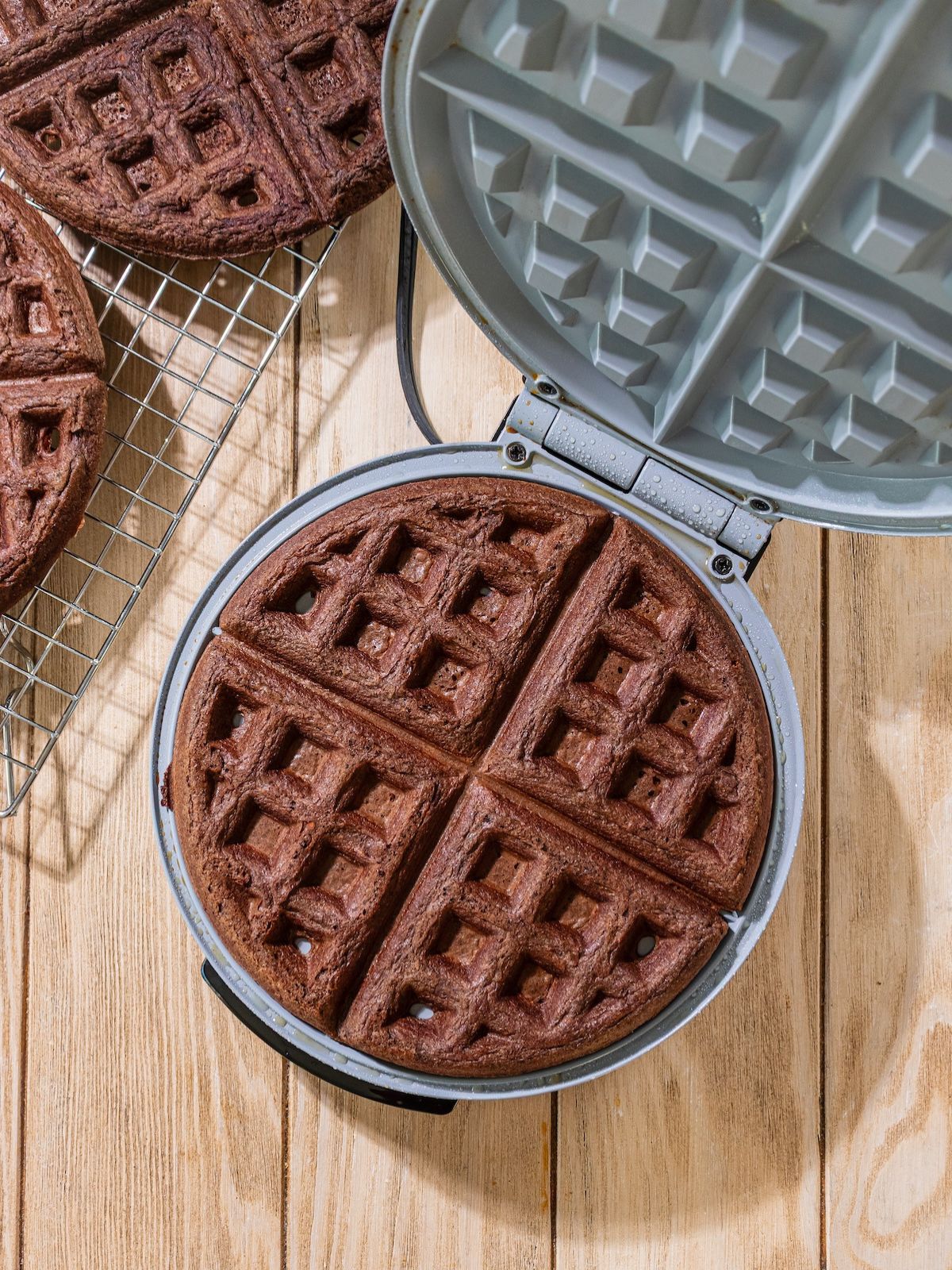 A waffle cooked in a waffle iron.