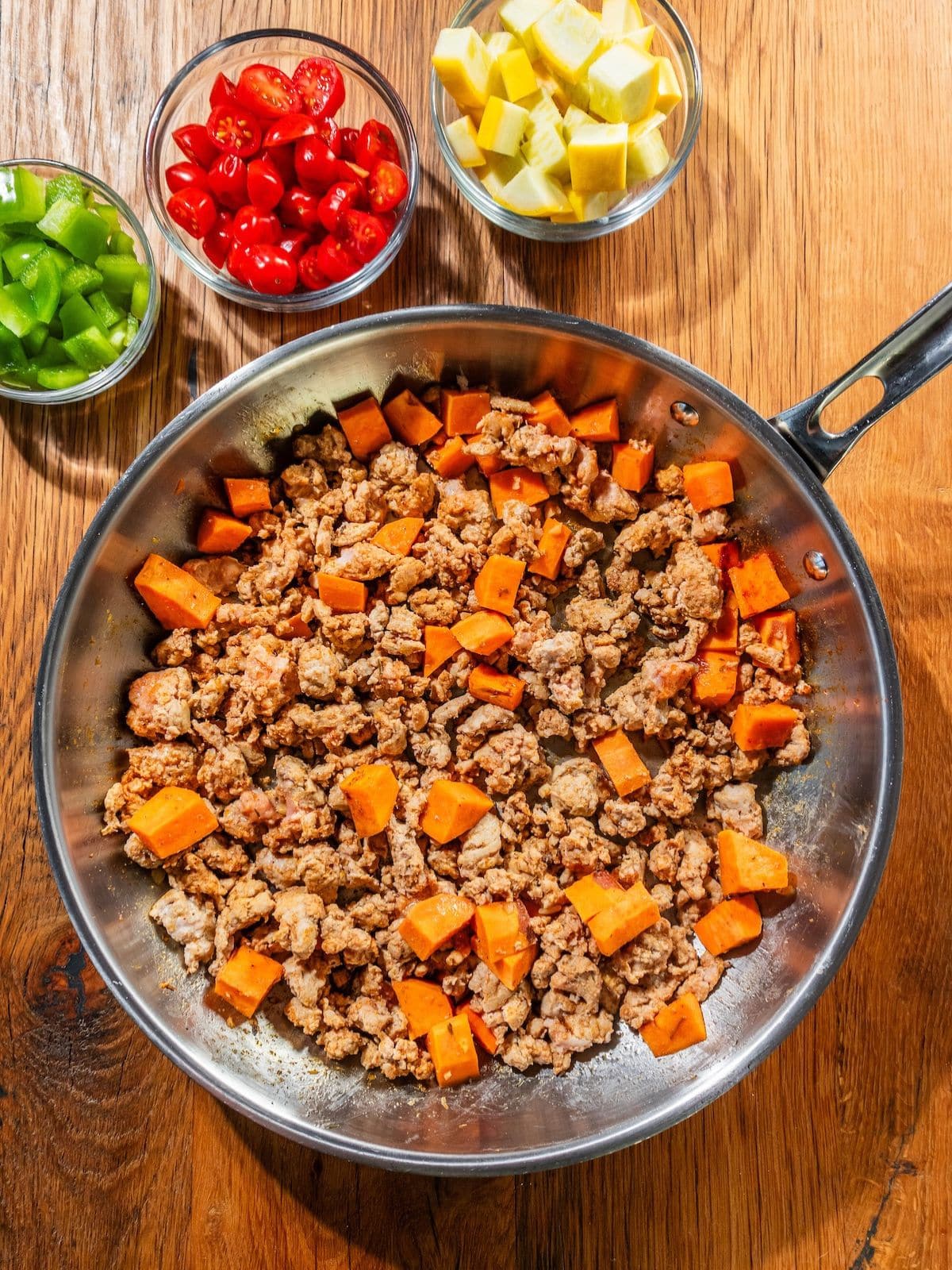 Ground turkey breast and sweet potato along with all the spices in the pan.