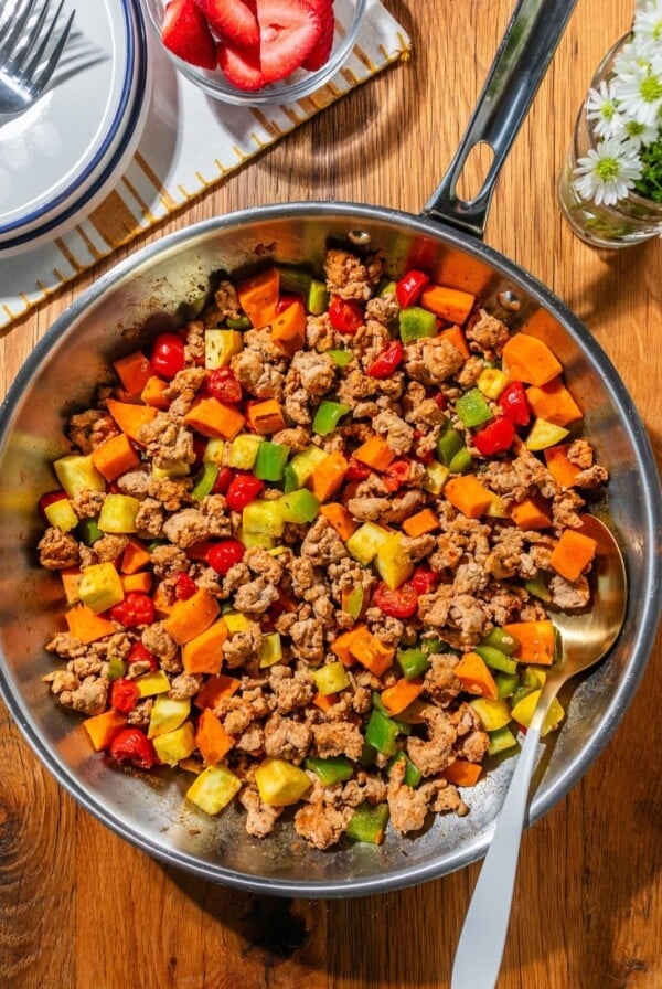 The hash cooking in the pan.
