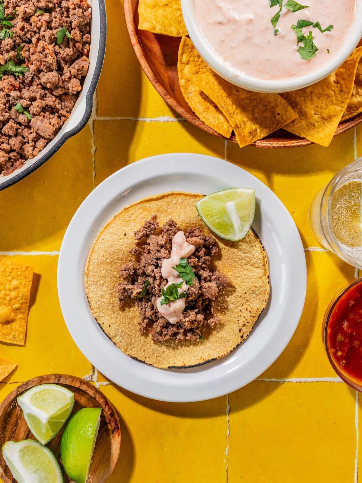 Creamy salsa dressing over top of a taco.