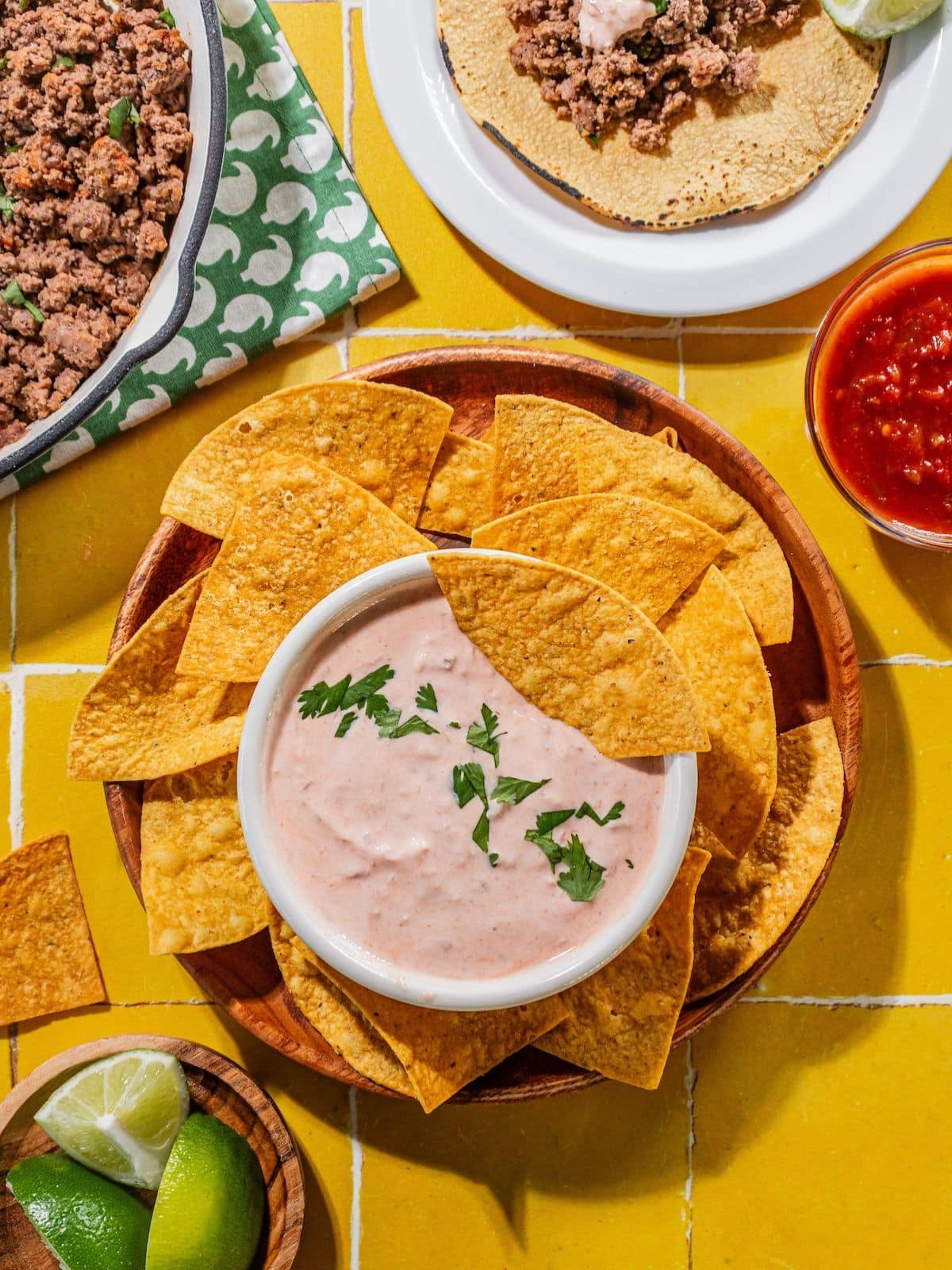 The bowl with the dressing ready to serve with chips.