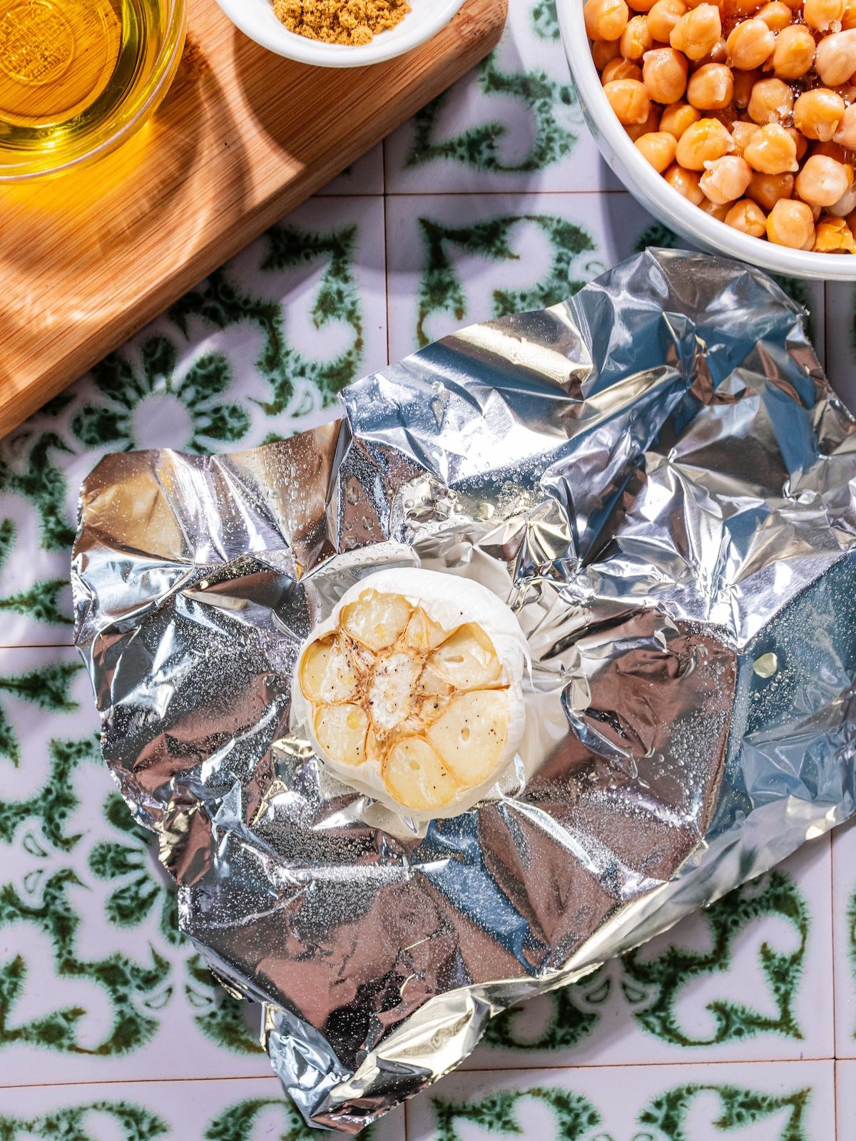 Garlic head on a piece of foil.