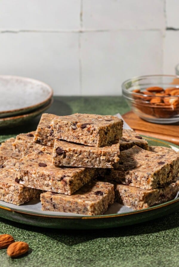 Gluten free granola bars stacked on a plate.