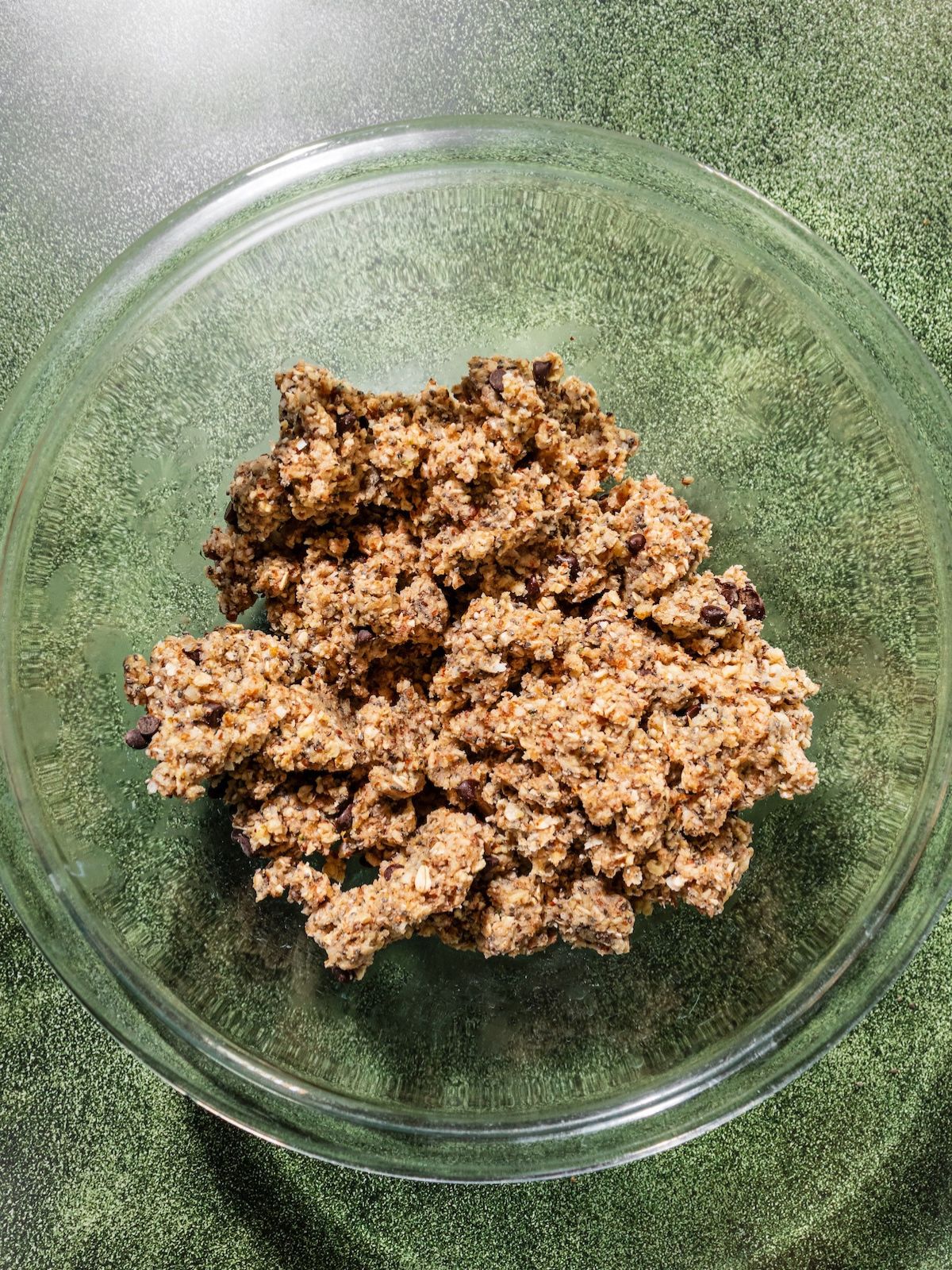 Mixture in a bowl and chocolate chips mixed in.