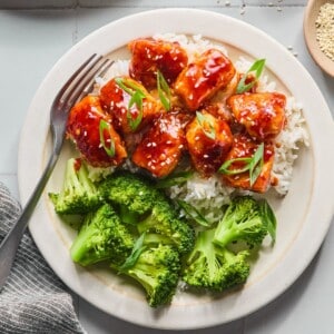 Healthy General Tso's chicken with rice and broccoli.
