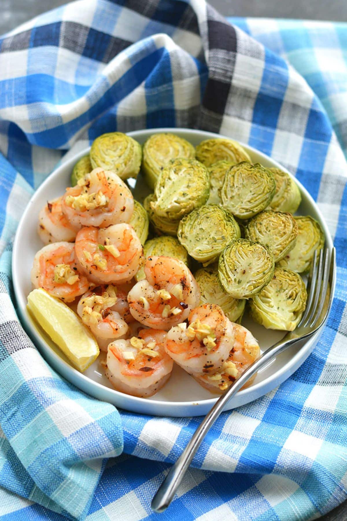 Sheet pan shrimp with brussels sprouts on the side.
