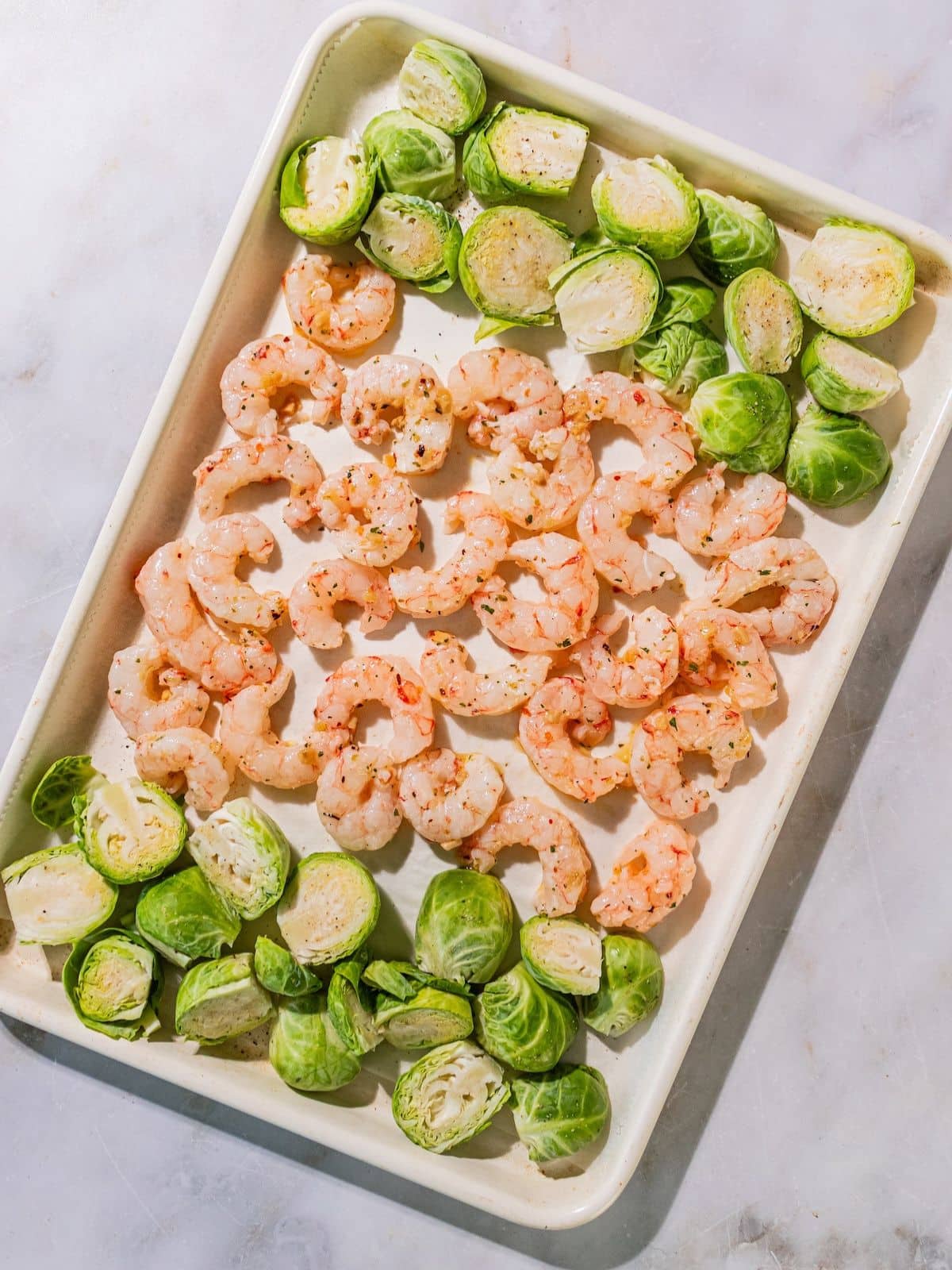 Shrimp added to the sheet pan.