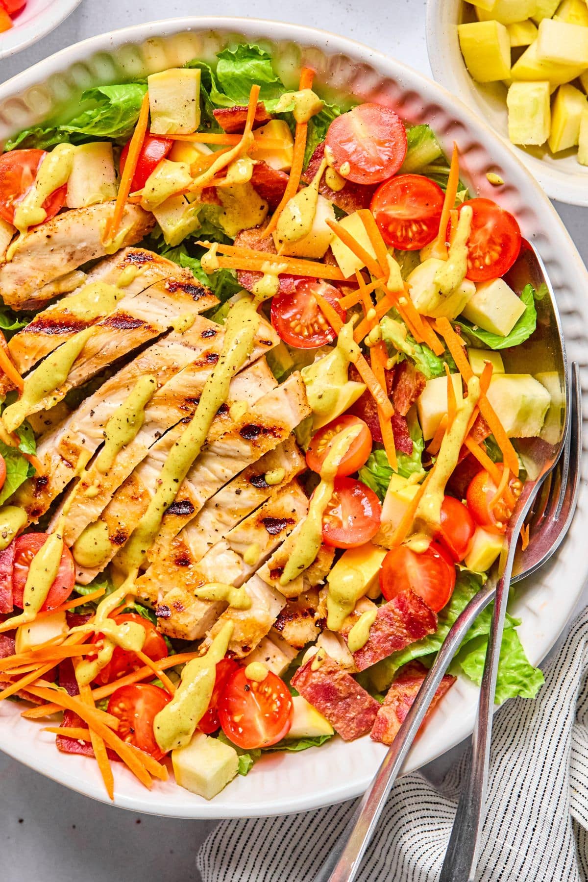 Chicken salad with dressing on top.