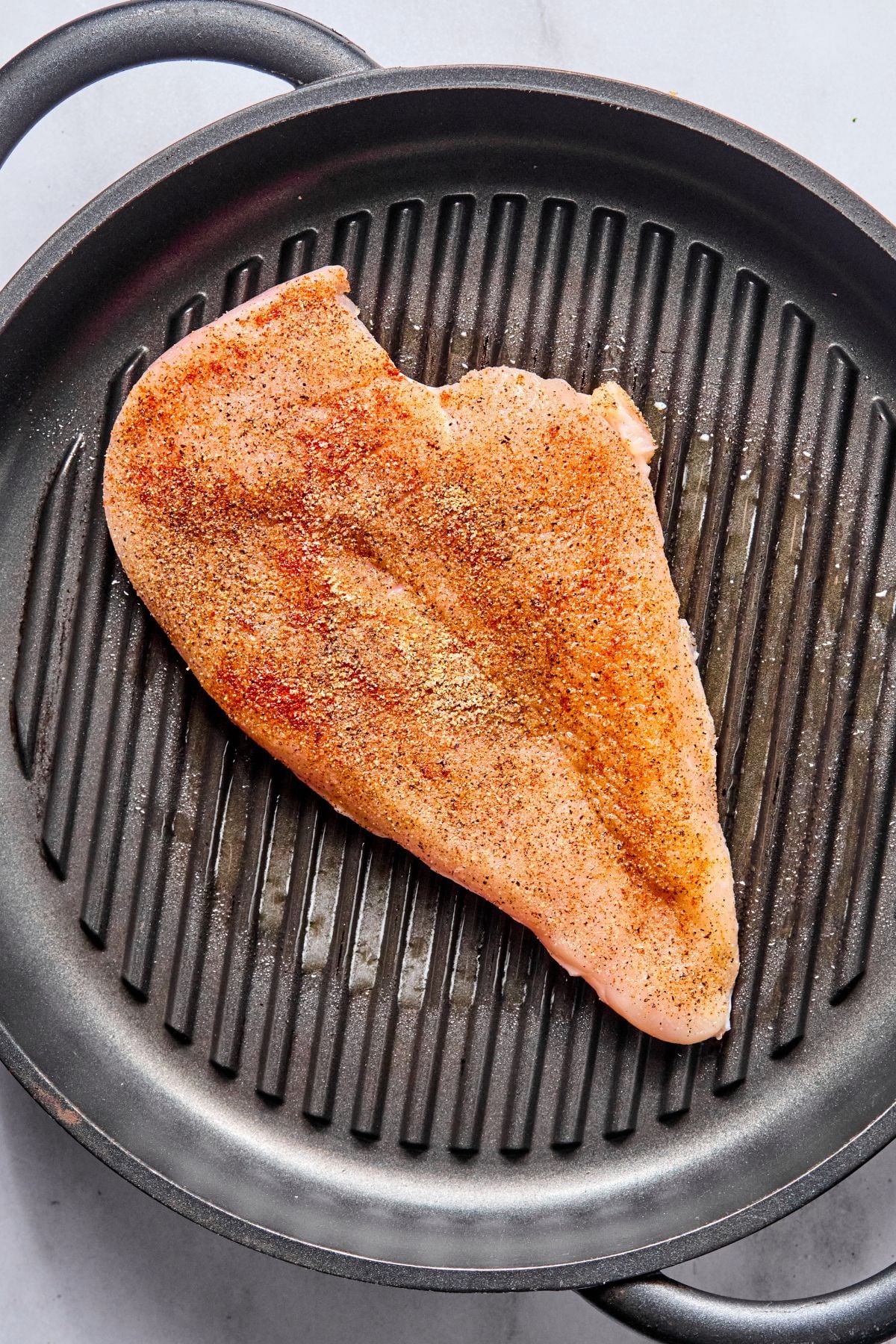Chicken put on a skillet to cook.