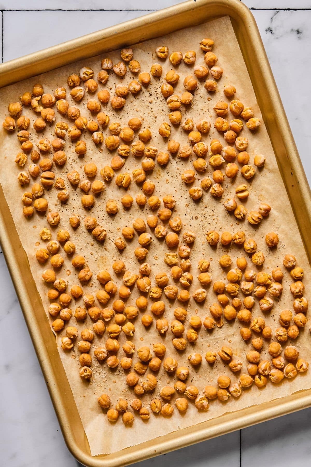 Garbanzo beans on a sheet pan.