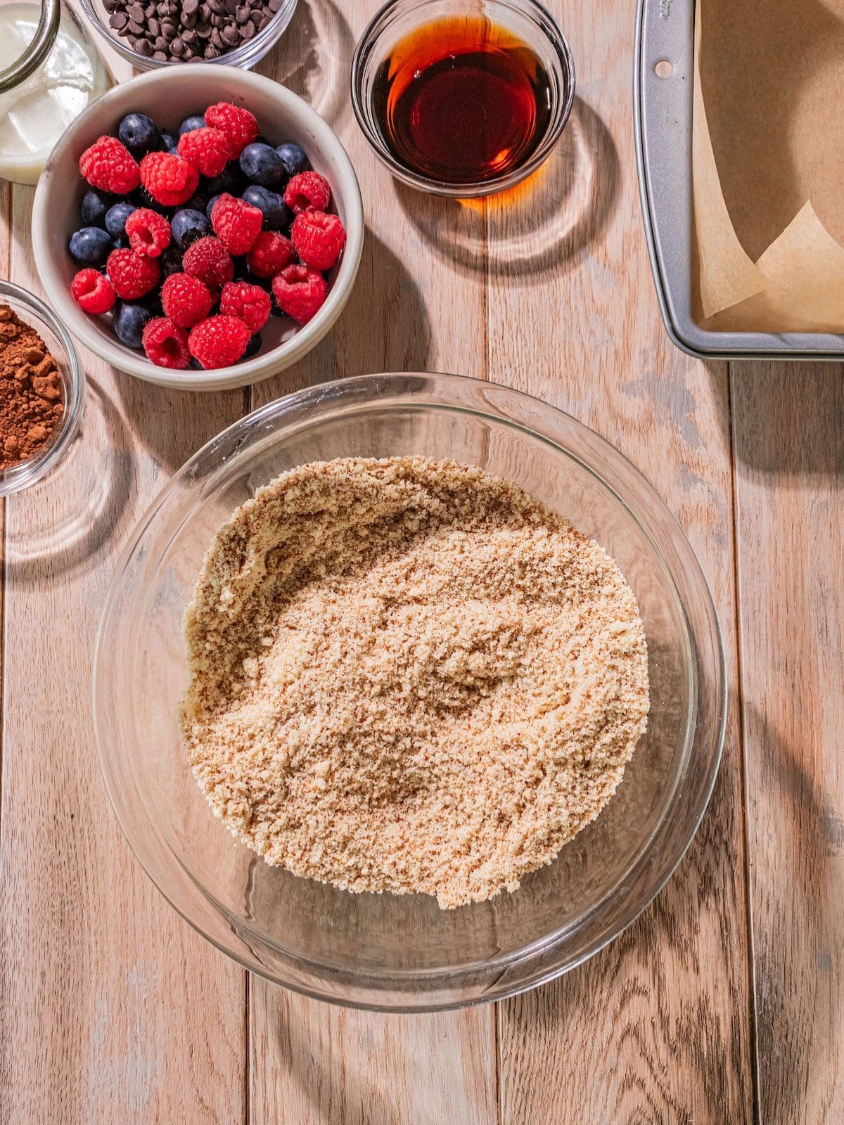 Almond flour, coconut flour, coconut sugar, salt, and baking soda in a bowl.