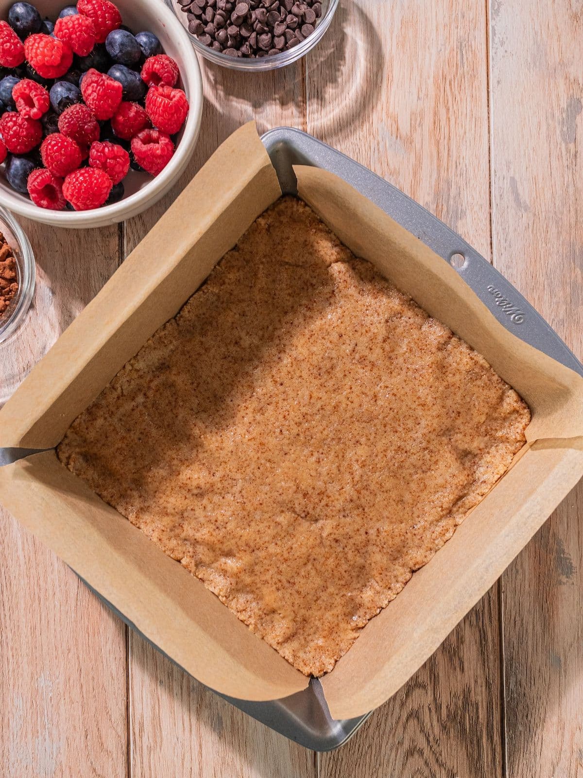 The mixture pressed into the prepared baking dish.