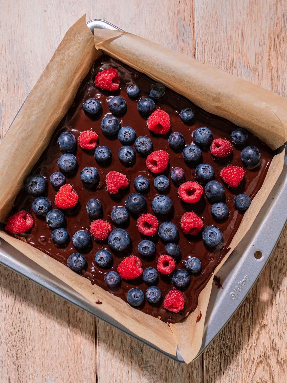 Berries on top of the melted chocolate.