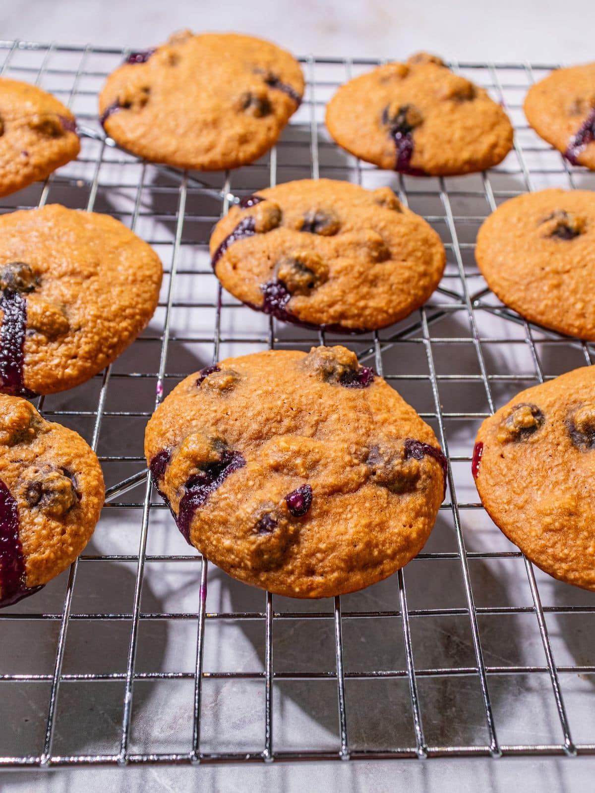 Healthy blueberry cookies cooling on a wire rack.
