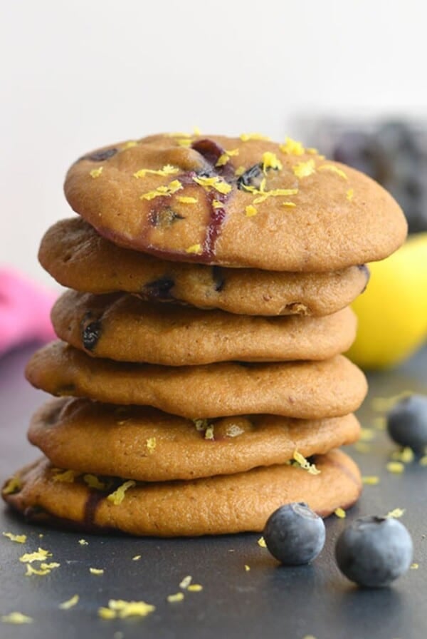 Healthy blueberry cookies stacked on a table.