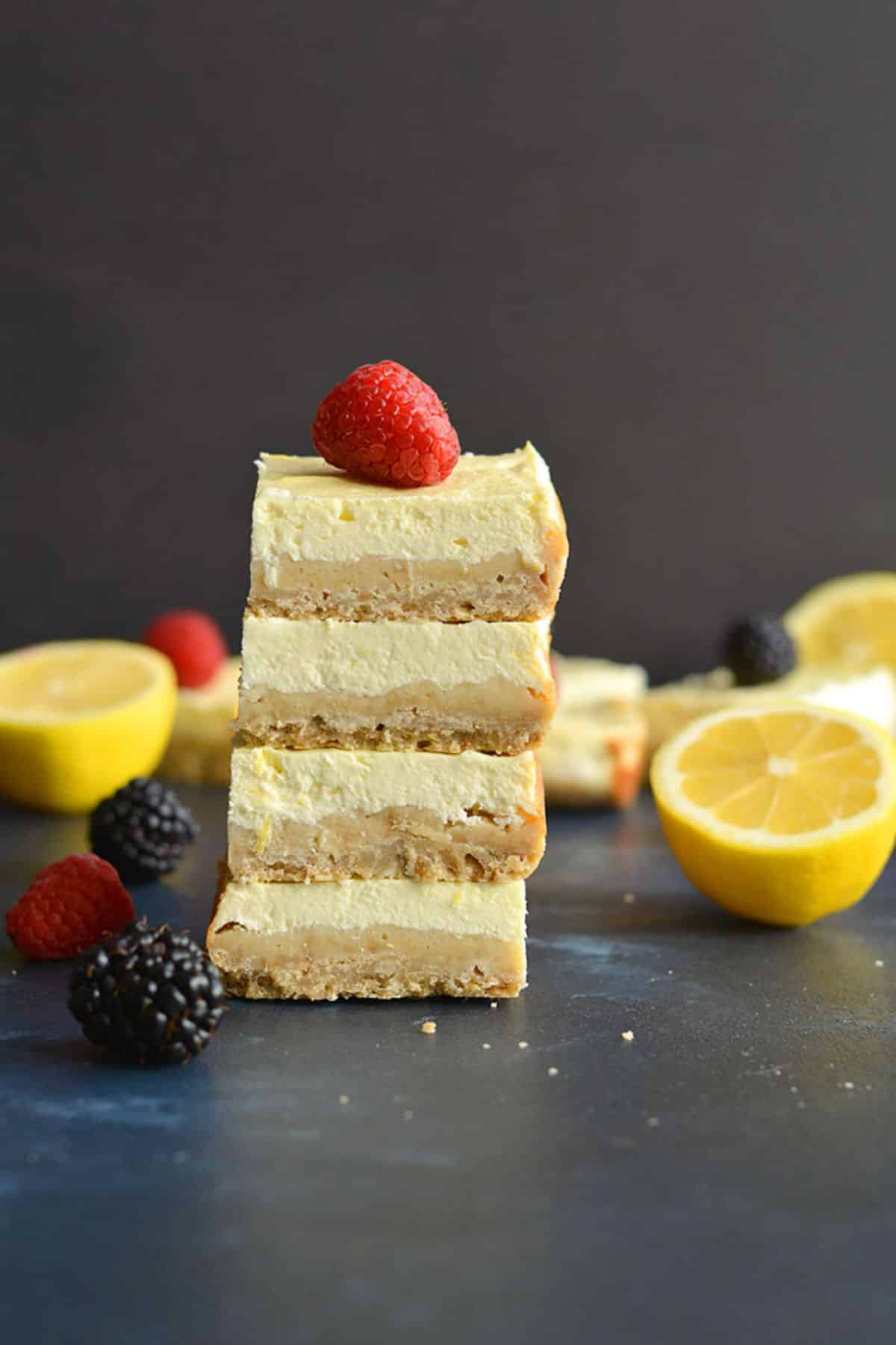 Low calorie lemon bars stacked on top of one another.